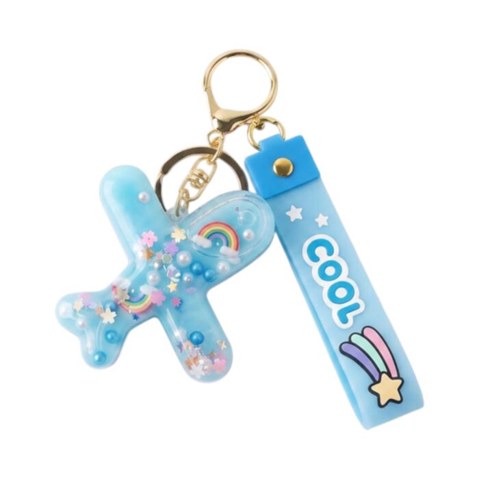 Brelok do torebki z PVC QuirKeys w kształcie tęczowego samolotu